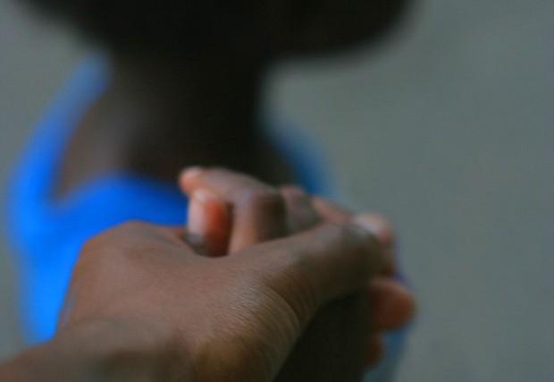 Parent and child holding hand