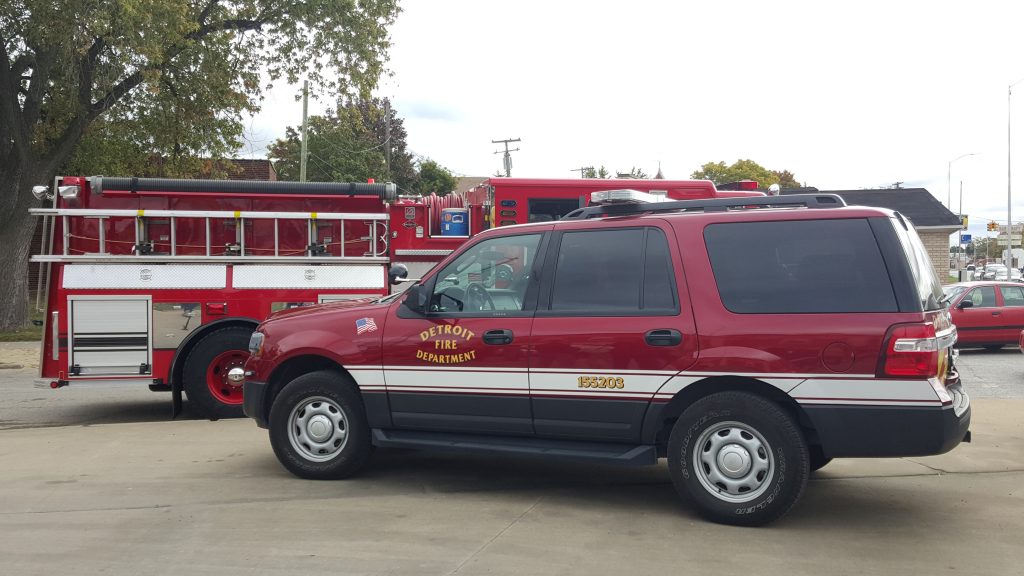 Detroit fire truck and support vehicles on scene