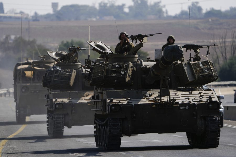 Israeli armored personnel carriers and tanks move towards the Gaza Strip border in southern Israel Wednesday, Nov. 1, 2023.