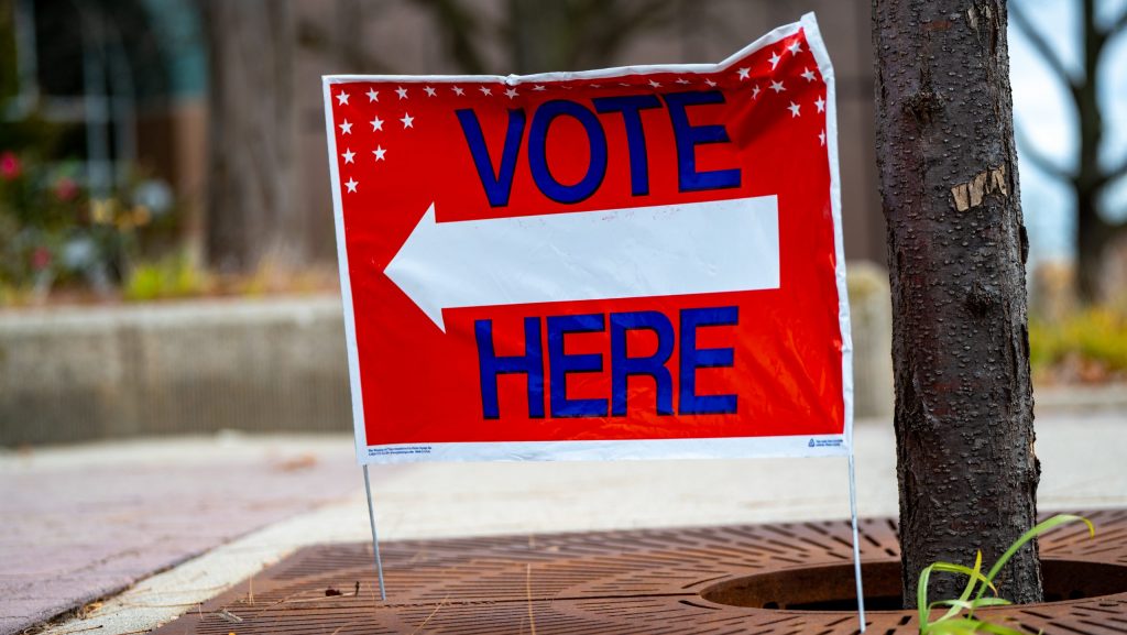 A directional Vote Here sign in Michigan