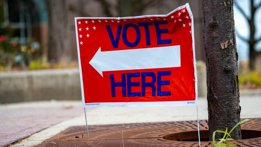 A directional Vote Here sign in Michigan