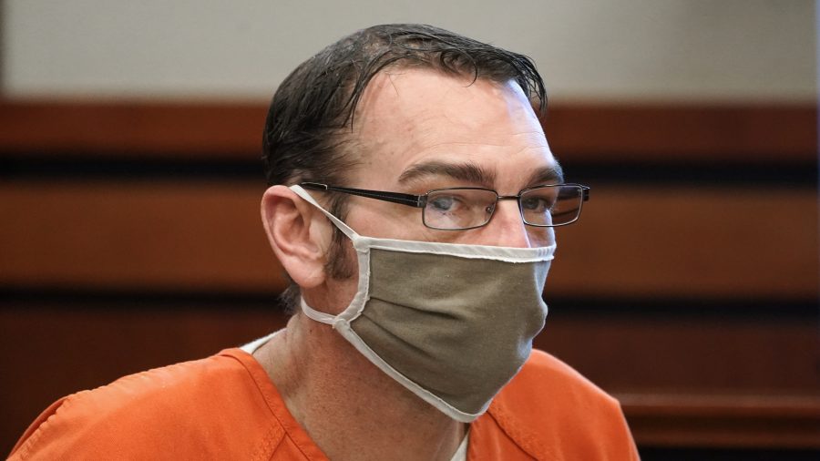 FILE -James Crumbley, father of Ethan Crumbley, a teenager accused of killing four students in a shooting at Oxford High School, appears in court for a preliminary examination on involuntary manslaughter charges in Rochester Hills, Mich., Tuesday, Feb. 8, 2022.